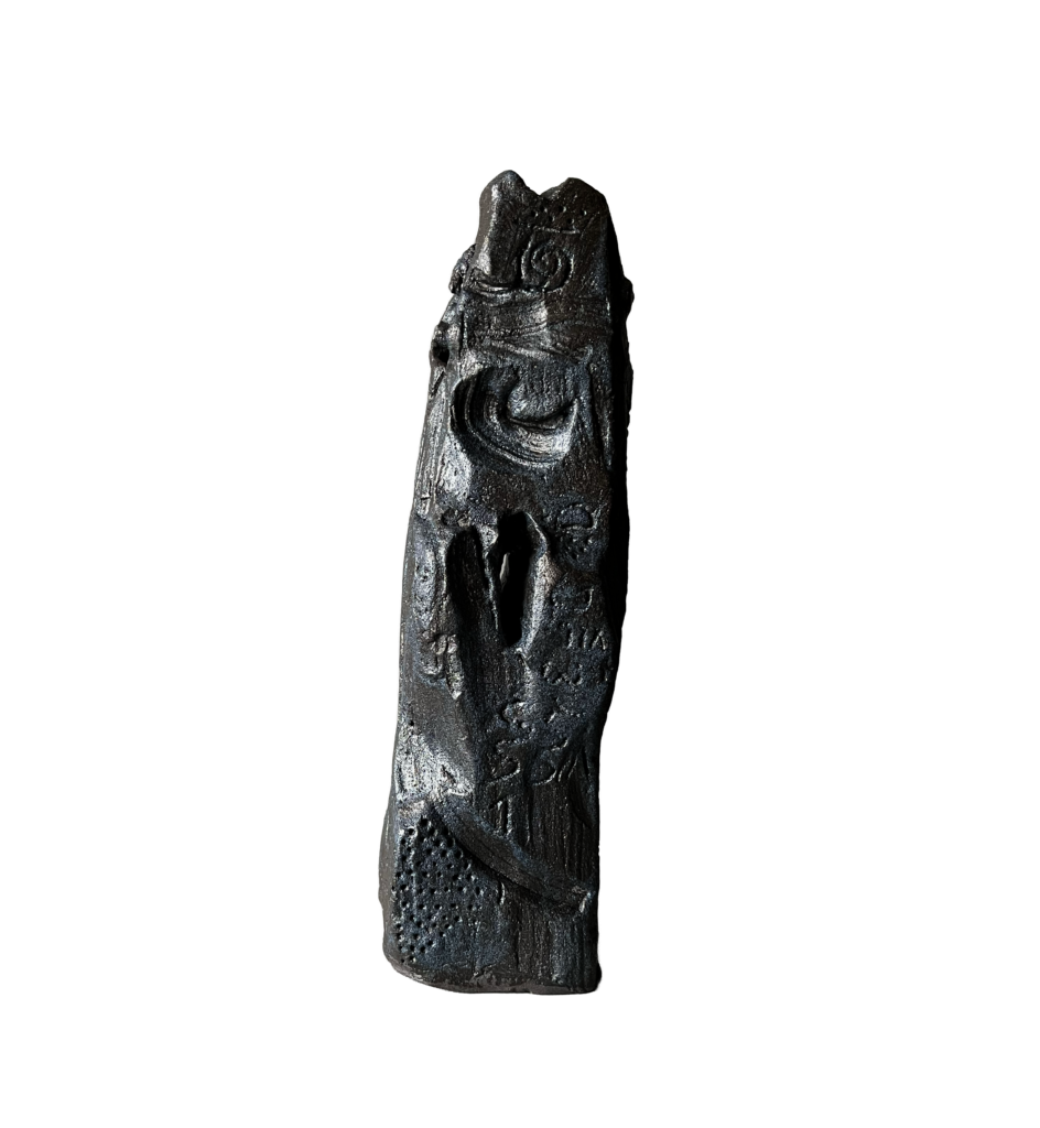 Black stoneware sculpture, Chronolith 04, tall irregular vertical form with incised geometric marks.