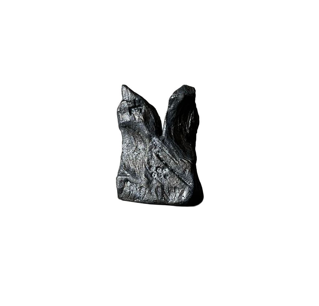 Black stoneware sculpture, Chronolith 05, short irregular form with incised geometric marks.